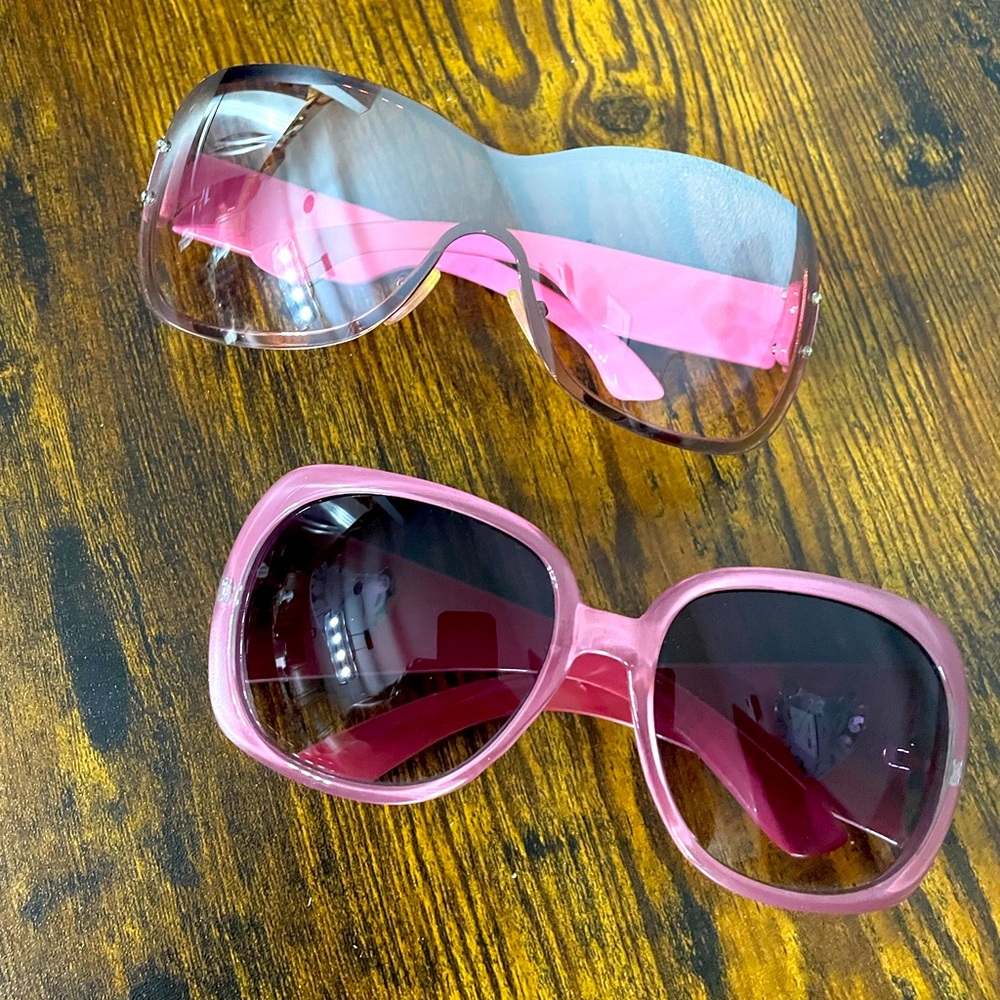 Two pairs of new sunglasses. Never worn. Pink.